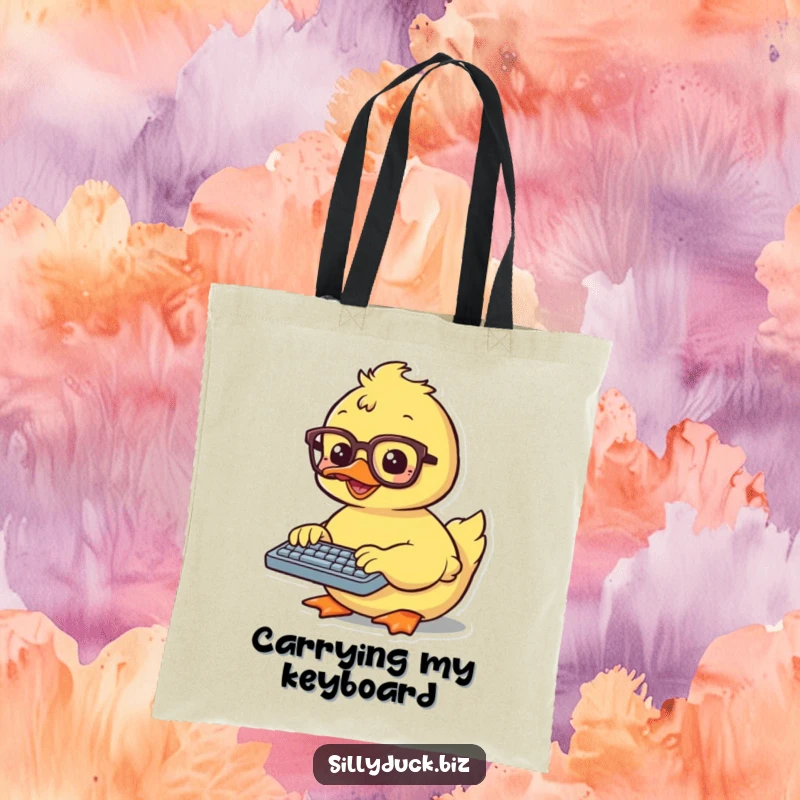 Funny Tote Bag features a kawaii duck wearing glasses, diligently typing on a small keyboard, perfect for carrying your gear.